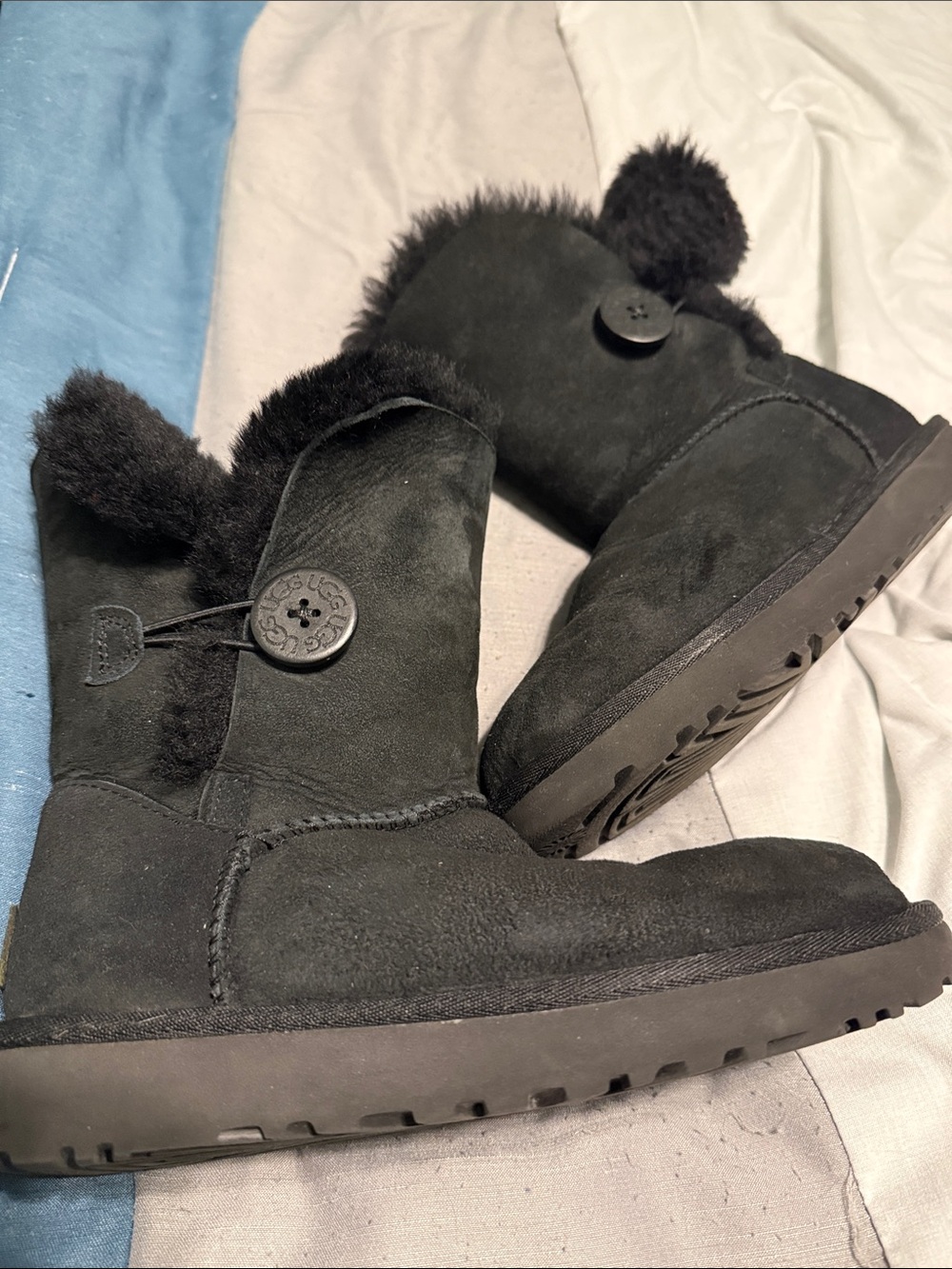 UGG Black Suede Short Button Boot with Pom Detail